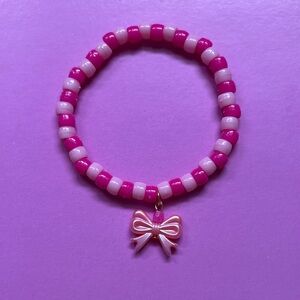 Pink Beaded Bracelet with Bow Charm